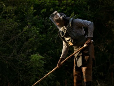 HALO worker wearing a protective vest and visor